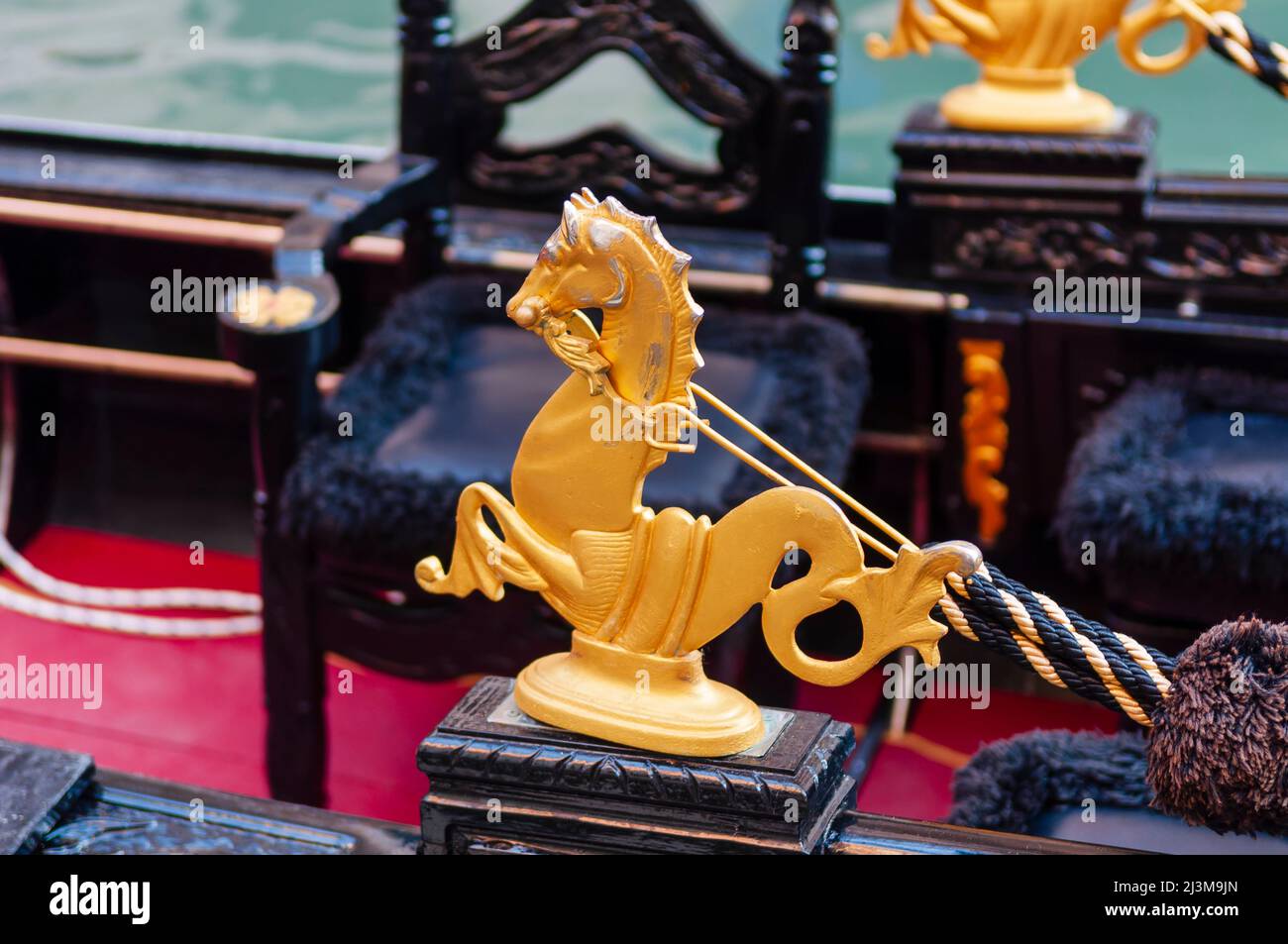 Close-up detail of a gold seahorse embellishment on a gondola; Venice, Veneto, Italy Stock Photo