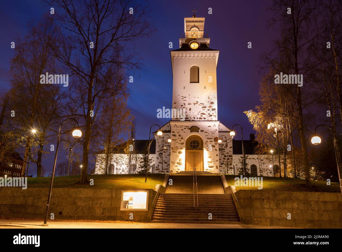 Old Lutheran Cathedral of Kuopio city in night autumn landscape. Finland Stock Photo