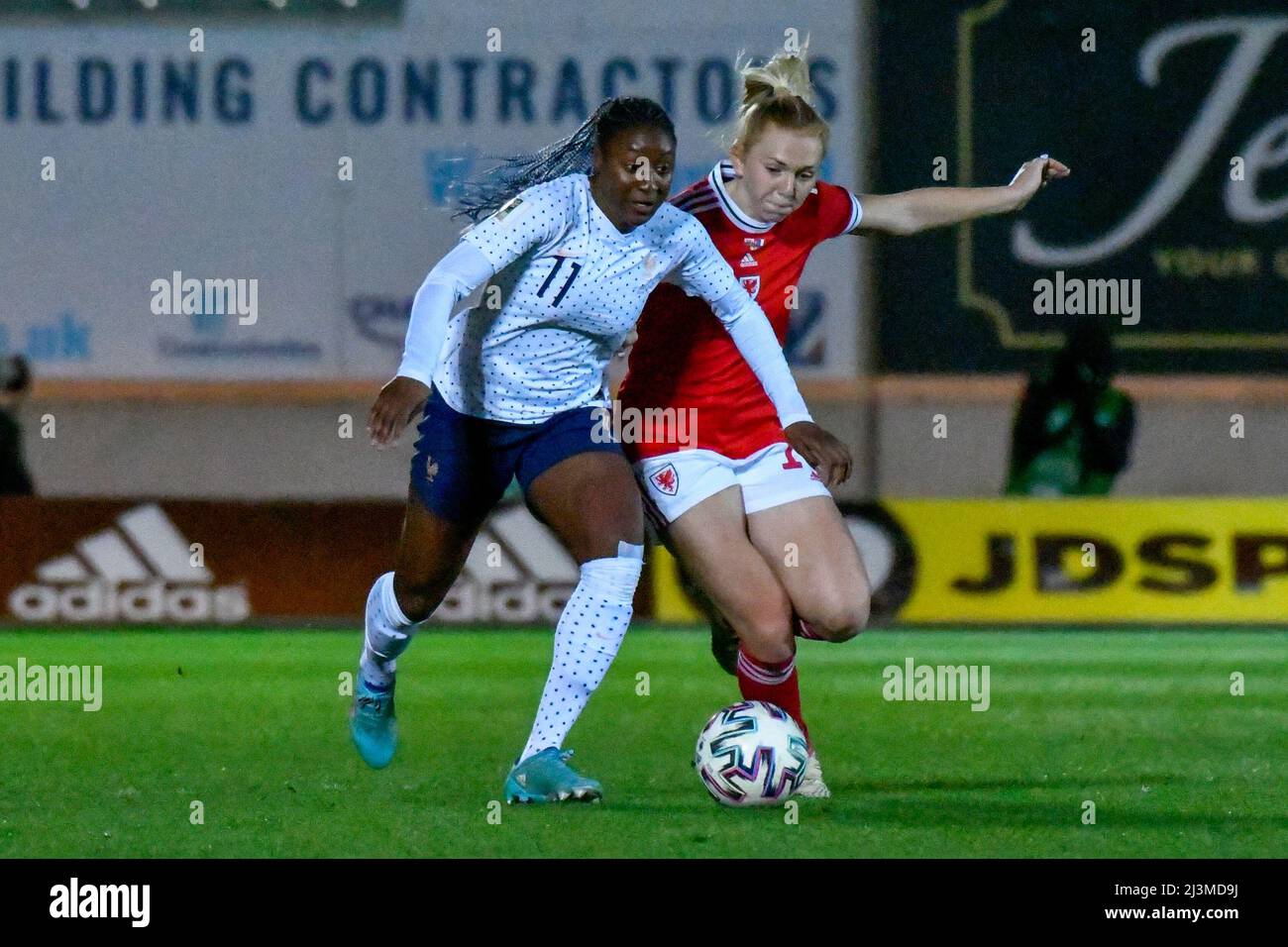 Llanelli, Wales. 8 April 2022. Kadidiatou Diani of France Women (left) battles with Ceri Holland of Wales Women during the FIFA Women's World Cup Qualifier Group I match between Wales Women and France Women at Parc y Scarlets in Llanelli, Wales, UK on 8 April 2022. Credit: Duncan Thomas/Majestic Media. Stock Photo