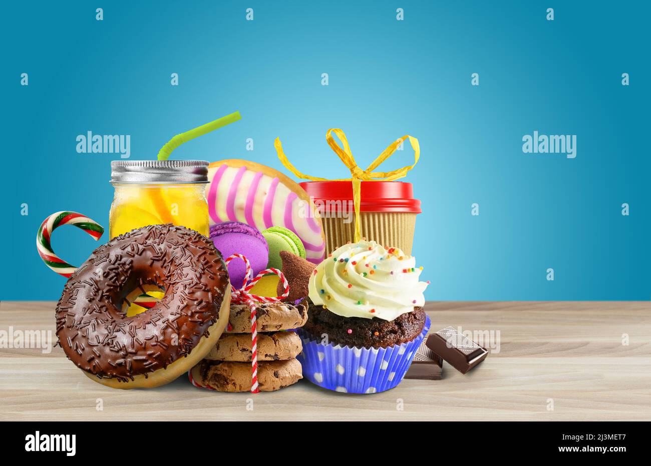 Various sweets on thr table on blue background Stock Photo