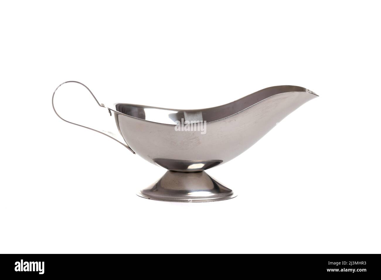 small gravy boat made of metal with a handle on a white isolated background Stock Photo