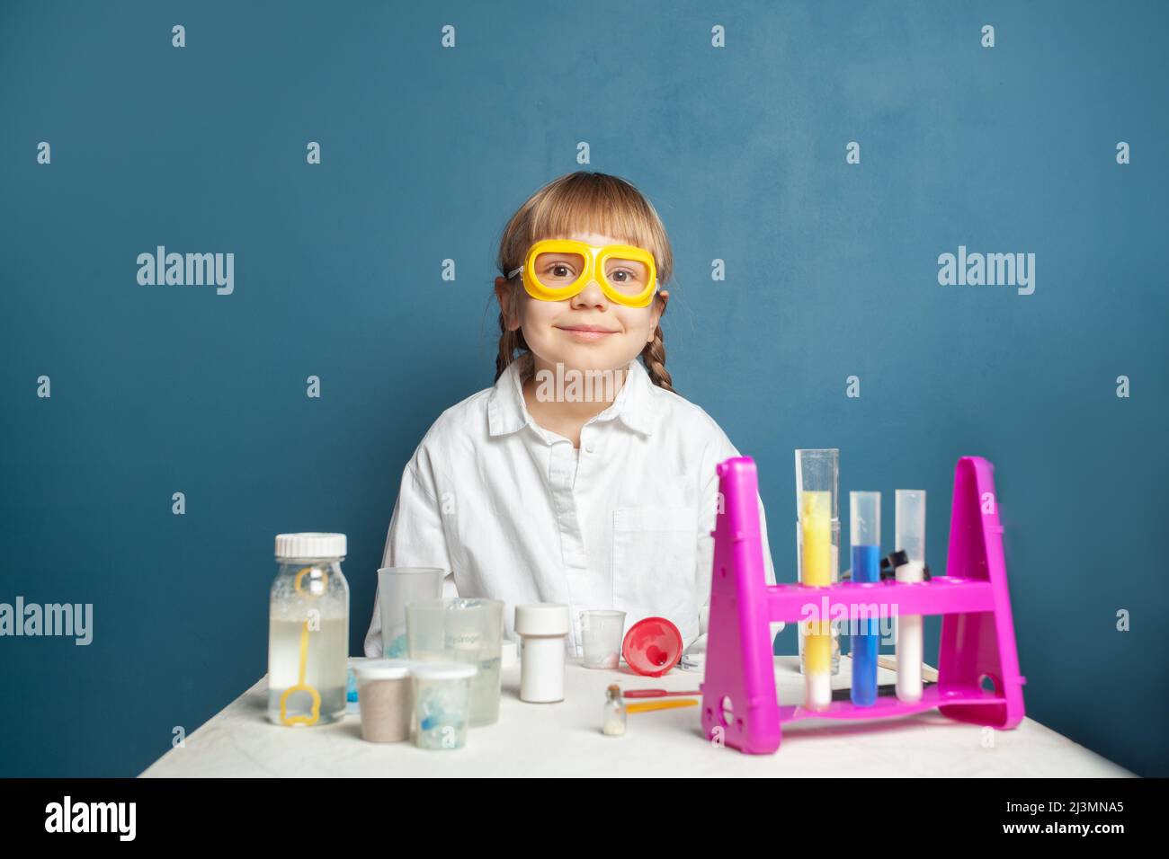 Learning science. Happy little child girl in science school Stock Photo ...