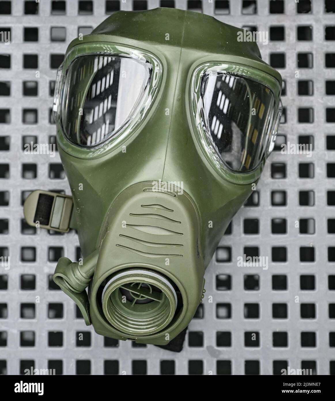 06 April 2022, Brandenburg, Strausberg: A Bundeswehr gas mask lies in a  container on the sidelines of the ceremonial roll call for the  commissioning of NBC Defense Regiment 1 at Barnim Barracks.