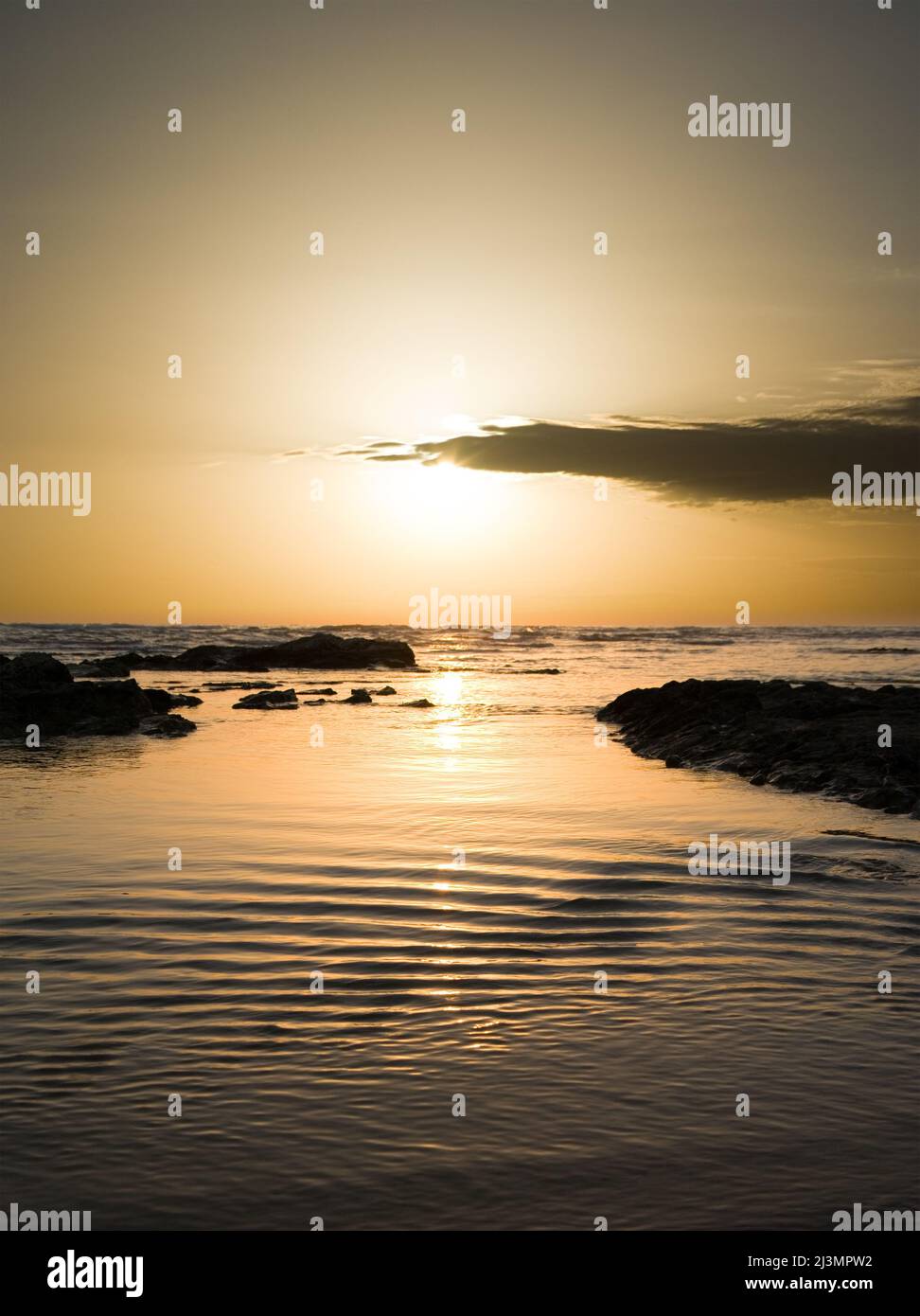 Sunset on water wavy of sea Stock Photo