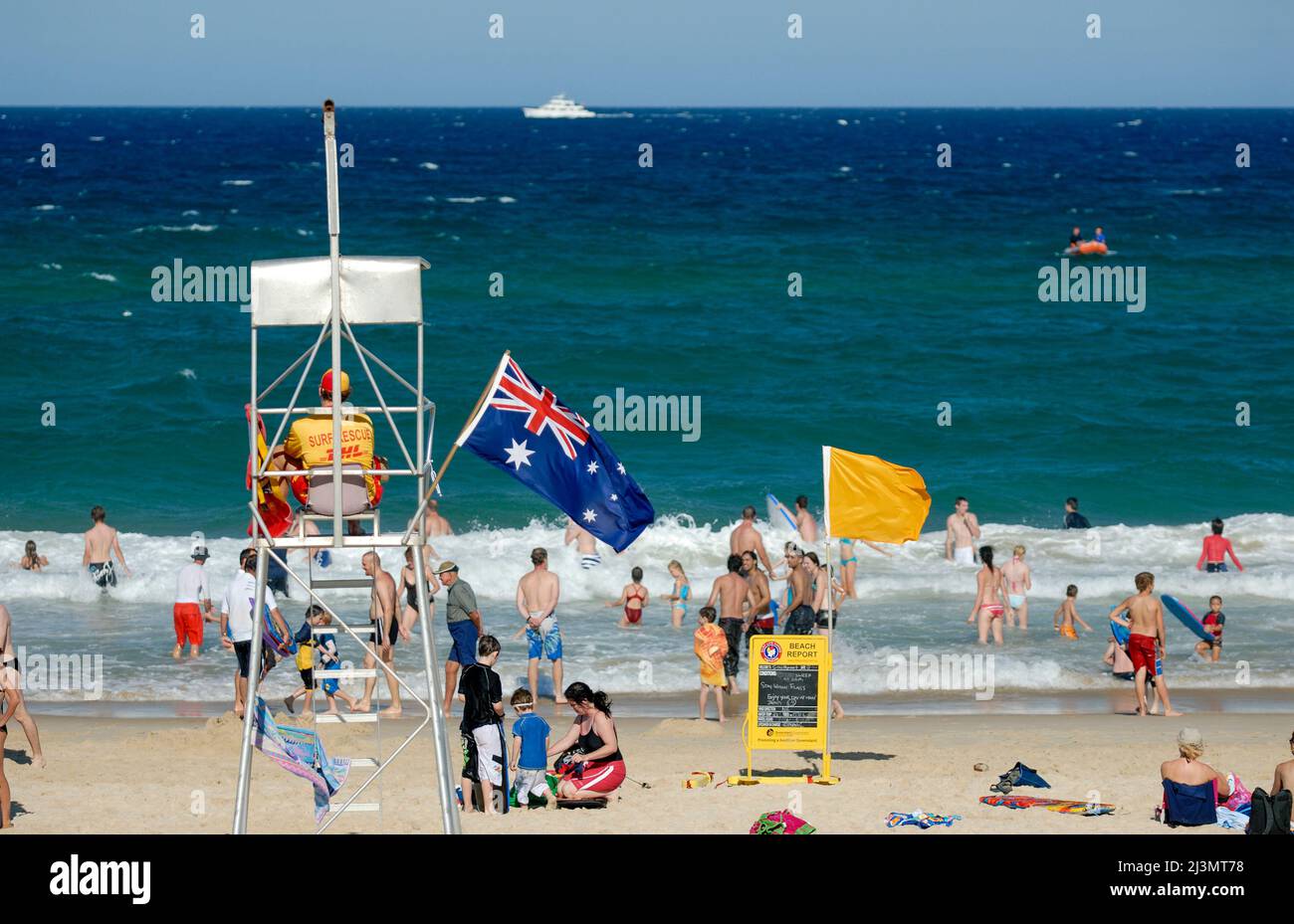 Surf lifesaver overseeing beach, watching for danger and people in distress. Stock Photo