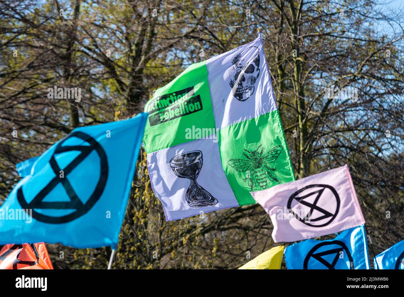 Hyde Park, London, UK. 9th Apr, 2022. Extinction Rebellion protesters are gathering at Speakers Corner in Hyde Park ahead of a period of civil resistance actions likely to cause disruption in London and beyond, in protest against alleged causes of climate change. XR symbol flags Stock Photo