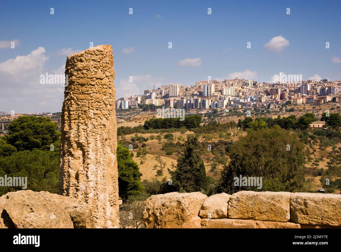 doric column on background city of Agrigento Stock Photo