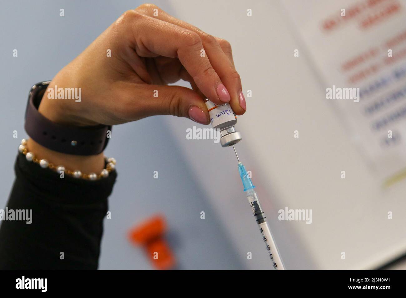 London. UK 8 Apr 2022- A doctor draws the first dose of the Pfizer COVID-19 jab as she prepares to administer the vaccine to a child under the age of 11 years at a vaccination centre. Parents and carers are encouraged to get children aged 5 to 11 their COVID-19 vaccine as over 5 million children in England are eligible for the jab. Children are offered two doses of the Pfizer/BioNTech vaccine, administered at least 12 weeks apart.  Credit Dinendra Haria /Alamy Live News Stock Photo