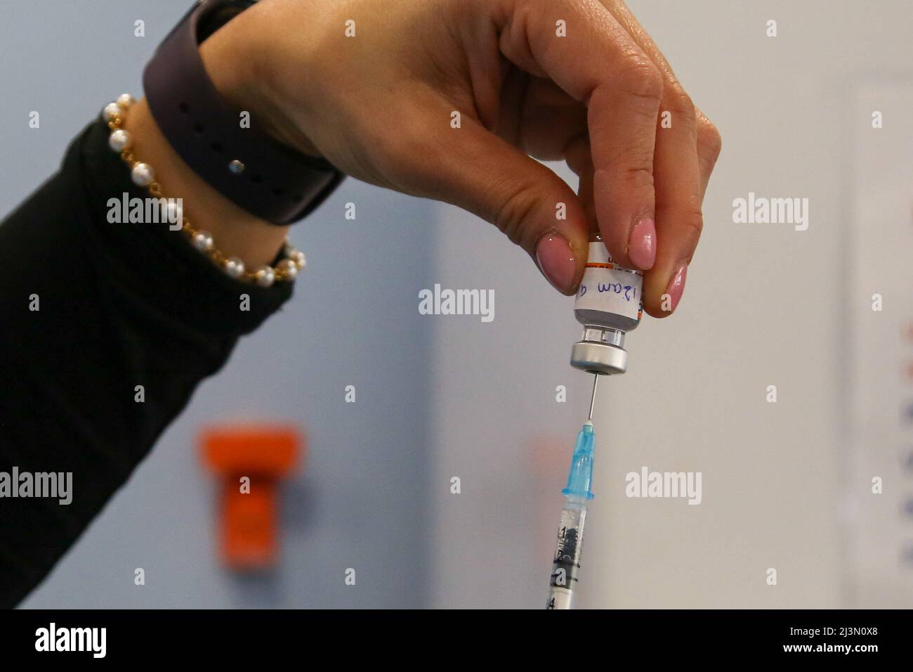 London. UK 8 Apr 2022 - A doctor draws the first dose of the Pfizer COVID-19 jab as she prepares to administer the vaccine to a child under the age of 11 years at a vaccination centre. Parents and carers are encouraged to get children aged 5 to 11 their COVID-19 vaccine as over 5 million children in England are eligible for the jab. Children are offered two doses of the Pfizer/BioNTech vaccine, administered at least 12 weeks apart.  Credit Dinendra Haria /Alamy Live News Stock Photo