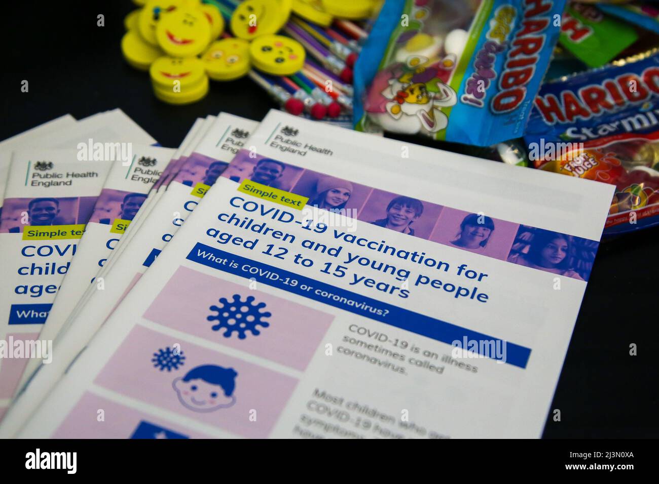 London. UK 8 Apr 2022 - 'COVID-19 vaccination for children and young people aged 12 to 15 years' information leaflet with goodies at a vaccination centre.  Credit Dinendra Haria /Alamy Live News Stock Photo