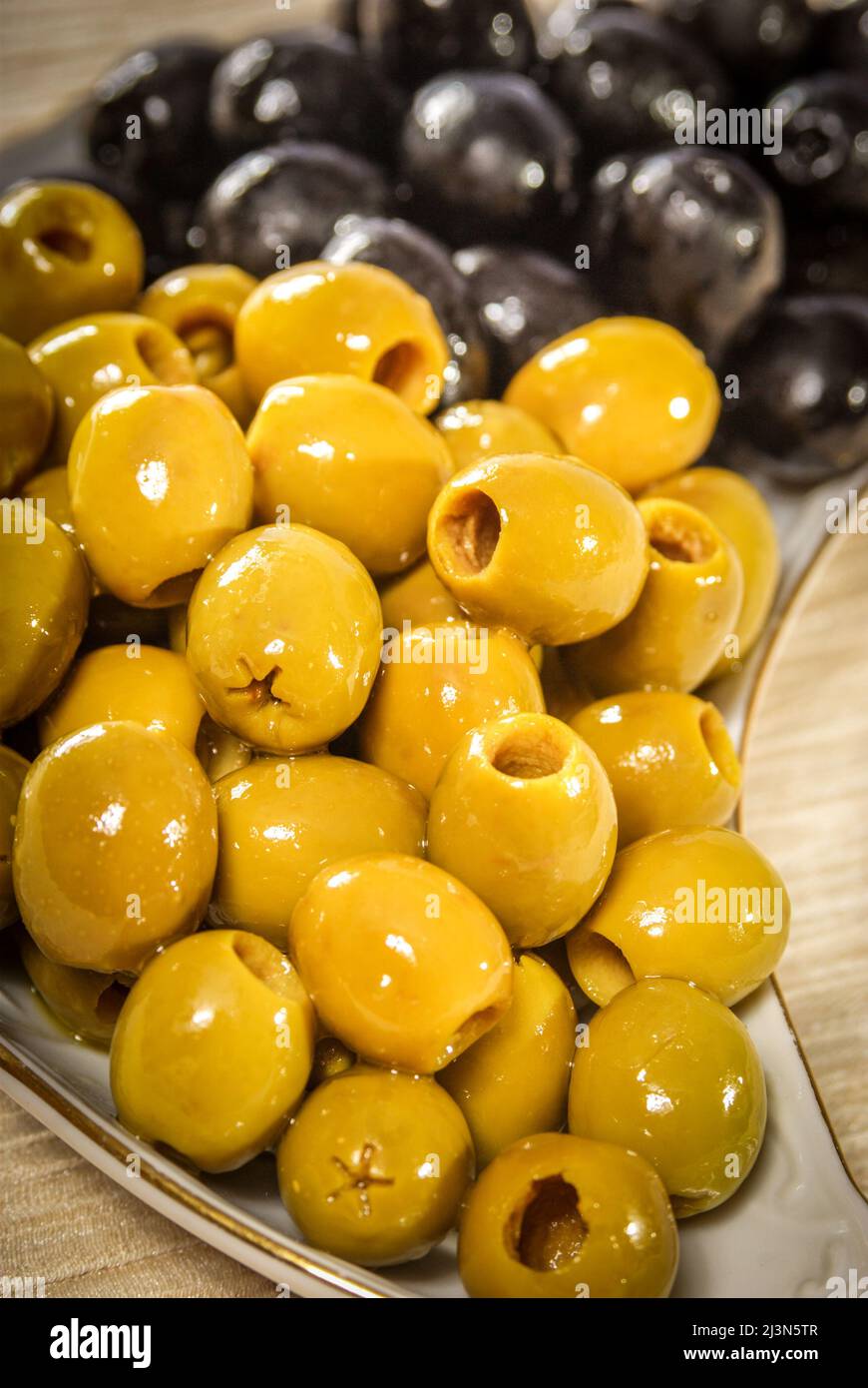 Pitted green and black olives Stock Photo Alamy