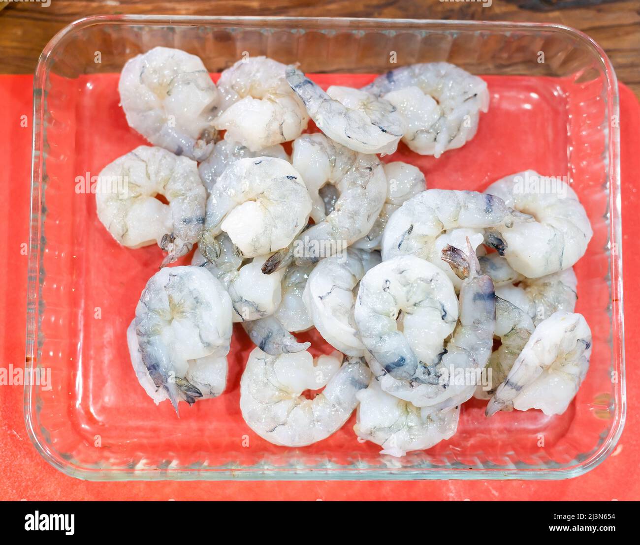 raw peel prawns in a white bowl without a marinate Stock Photo Alamy