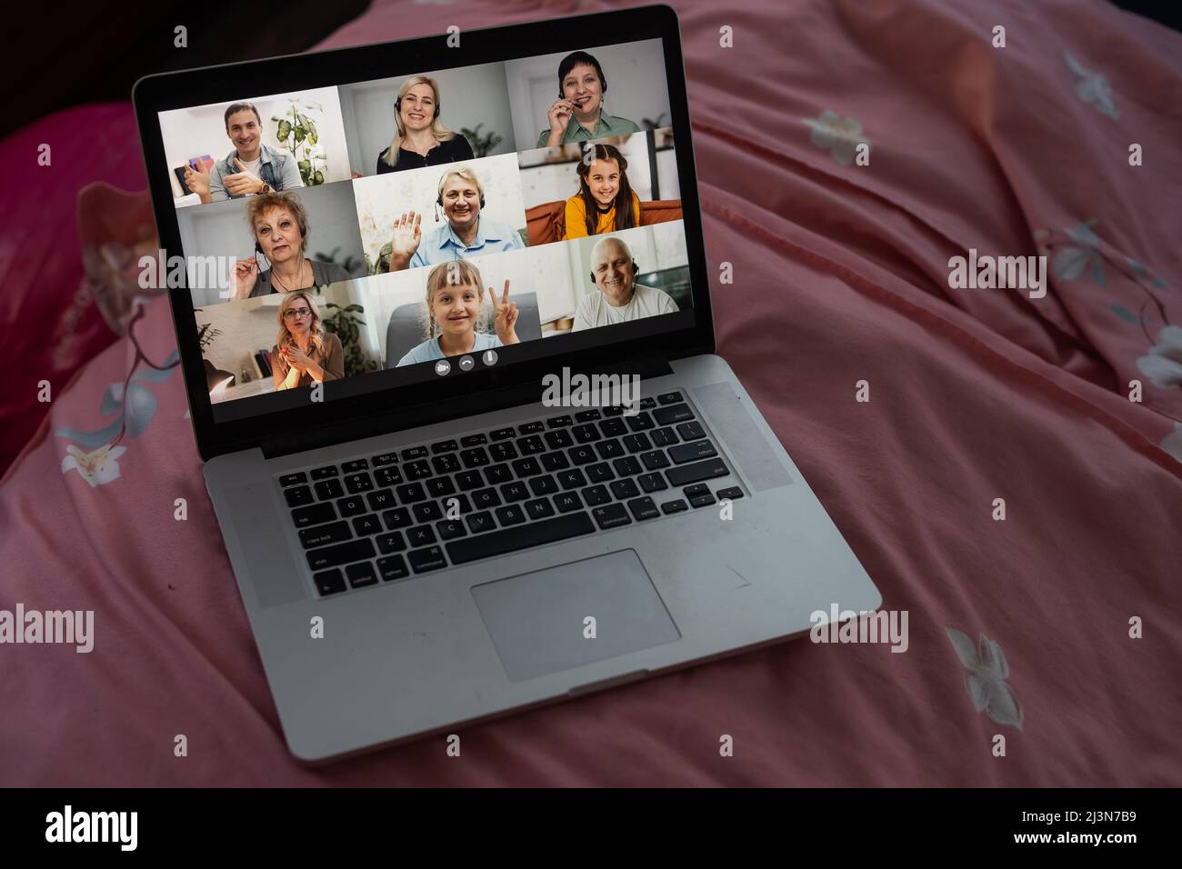 distance video group conference call in bedroom. fun chatting during virtual meeting at home