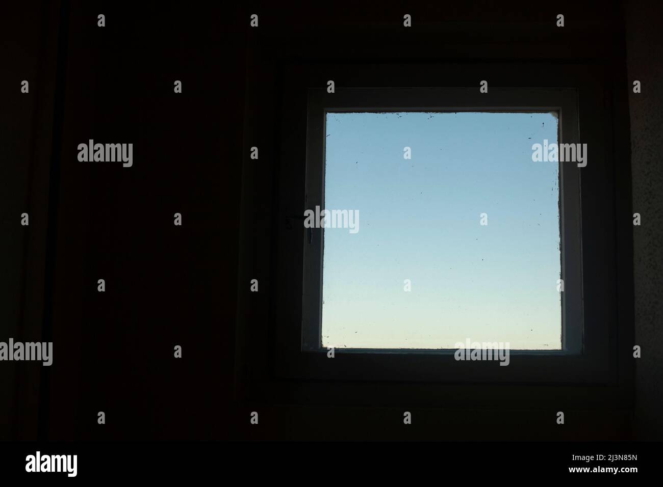 Sky is in window. Backlight from window. Light square on dark
