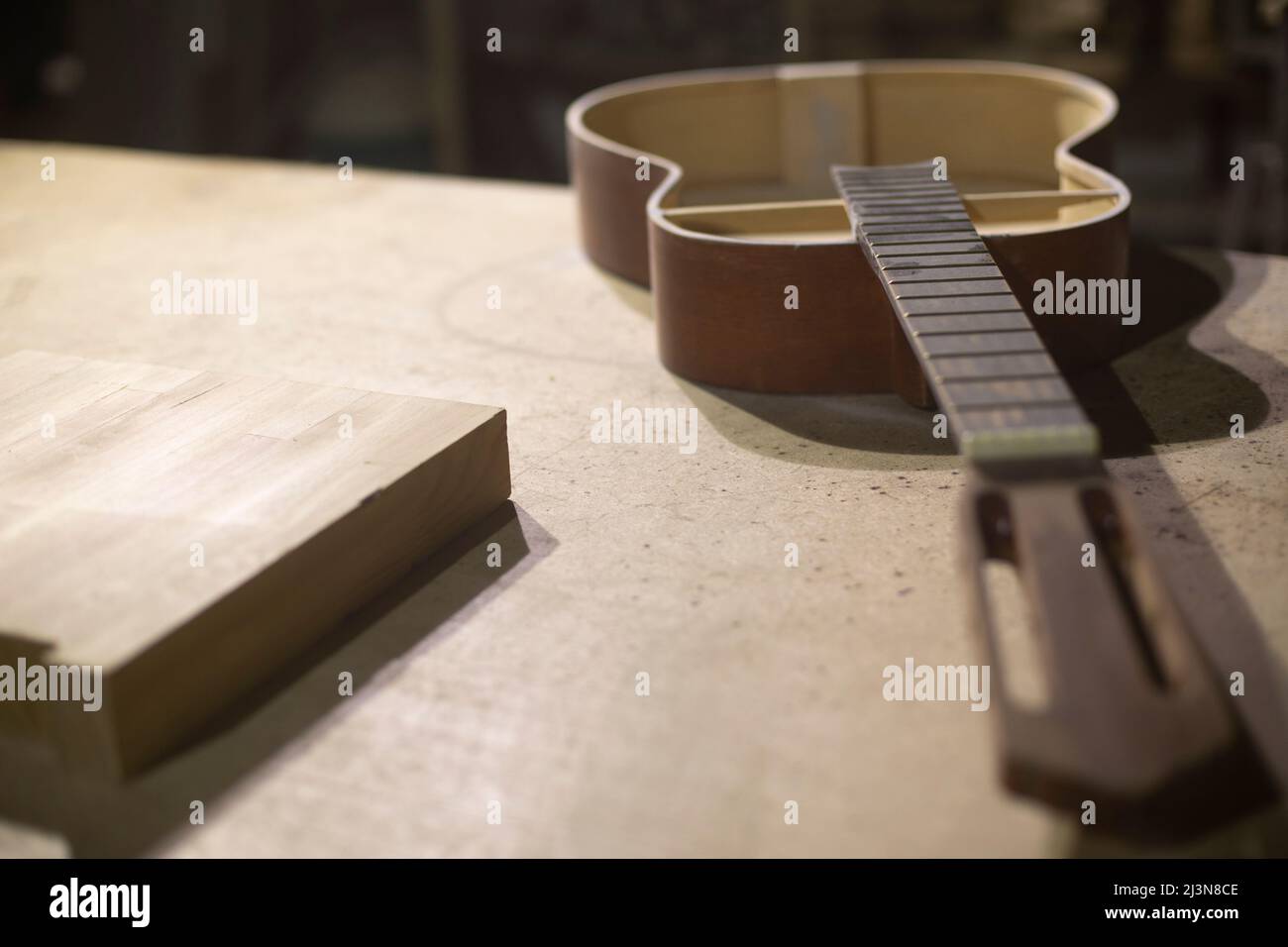 Acoustic guitar repair. Guitar without body. Details of wood