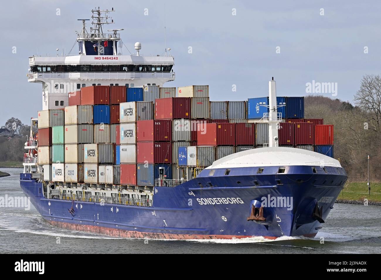 Containership SONDERBORG passing the Kiel Canal Stock Photo