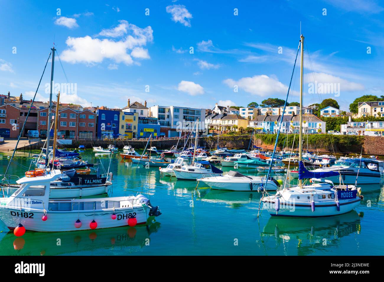 View of Paignton Harbour with boat moorings and restaurants,Devon