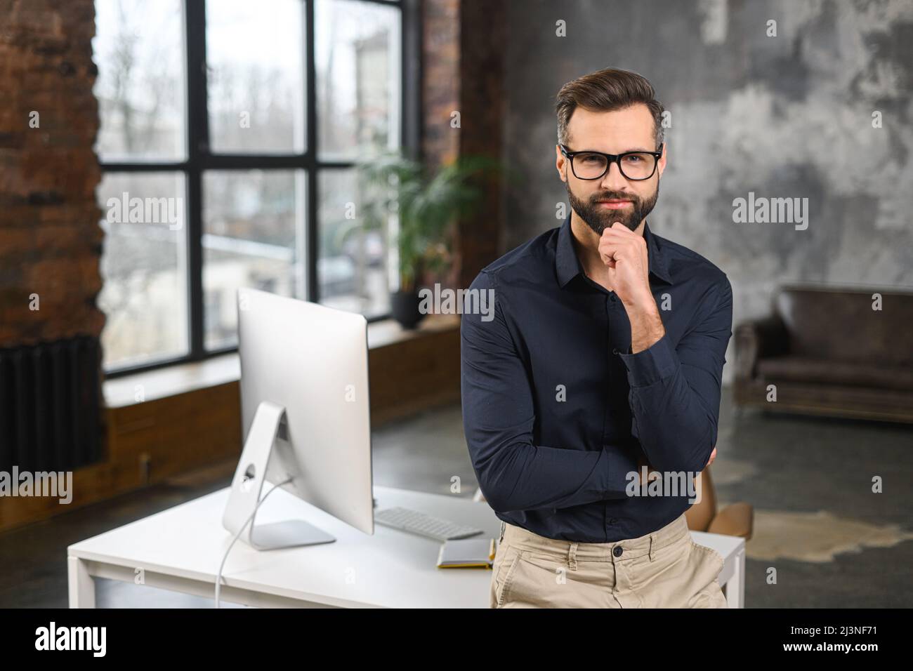 Successful masculine businessman in formal expensive suit, holding arm ...