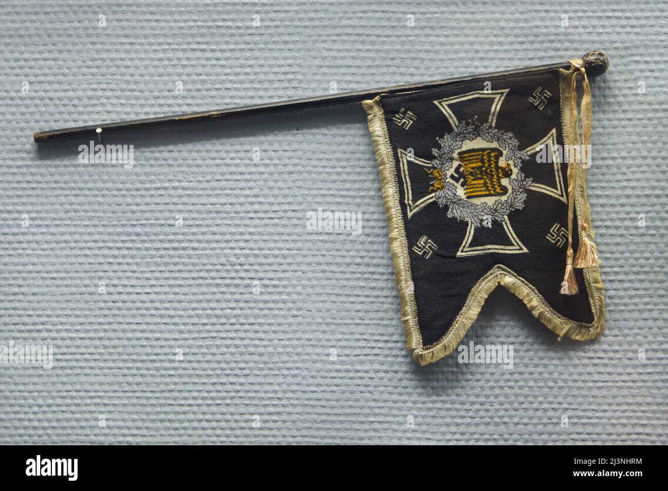 Command flag of a German's general officer stolen on his vehicle parked in front of the Reims railway station by a young boy aged 15 in 1941, now on display in the Museum of the Surrender (Musée de la Reddition) in Reims, France. The first German Instrument of Surrender that ended World War II in Europe was signed at 02:41 Central European Time (CET) on 7 May 1945 in the building which serves now as the museum. Stock Photo