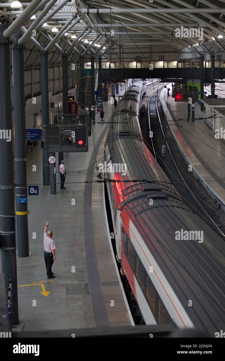 Train dispatch at Leeds railway station, UK.  A LNER/ Virgin east coast  train about to depart Stock Photo