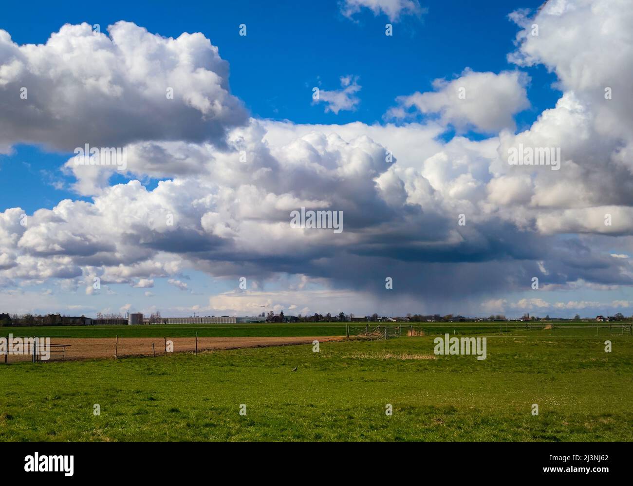 April shower over the green countryside of Holland Stock Photo - Alamy