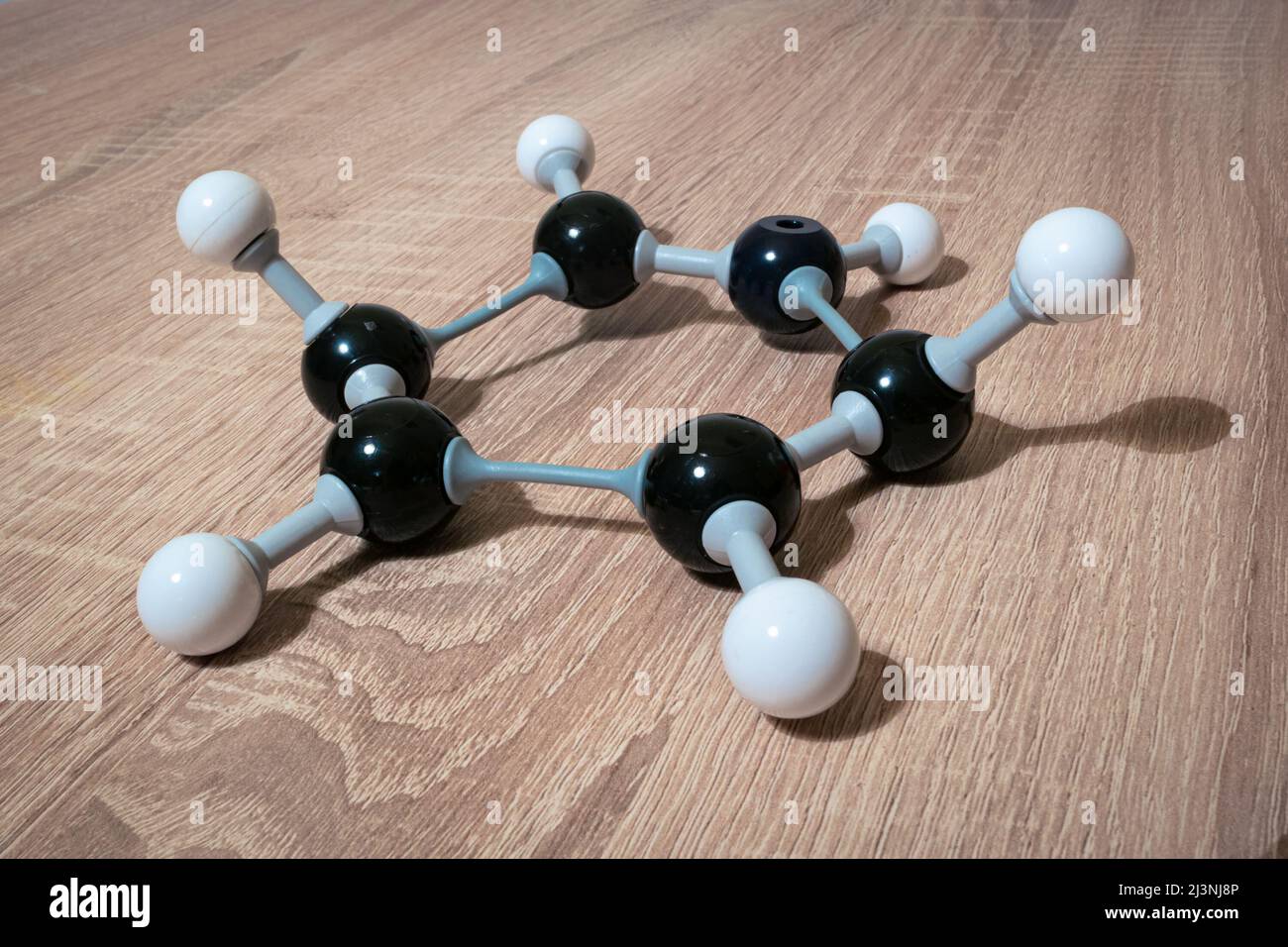 Model of benzene molecule (chemical formula C6H6), a hydrocarbon, used in chemistry class Stock Photo