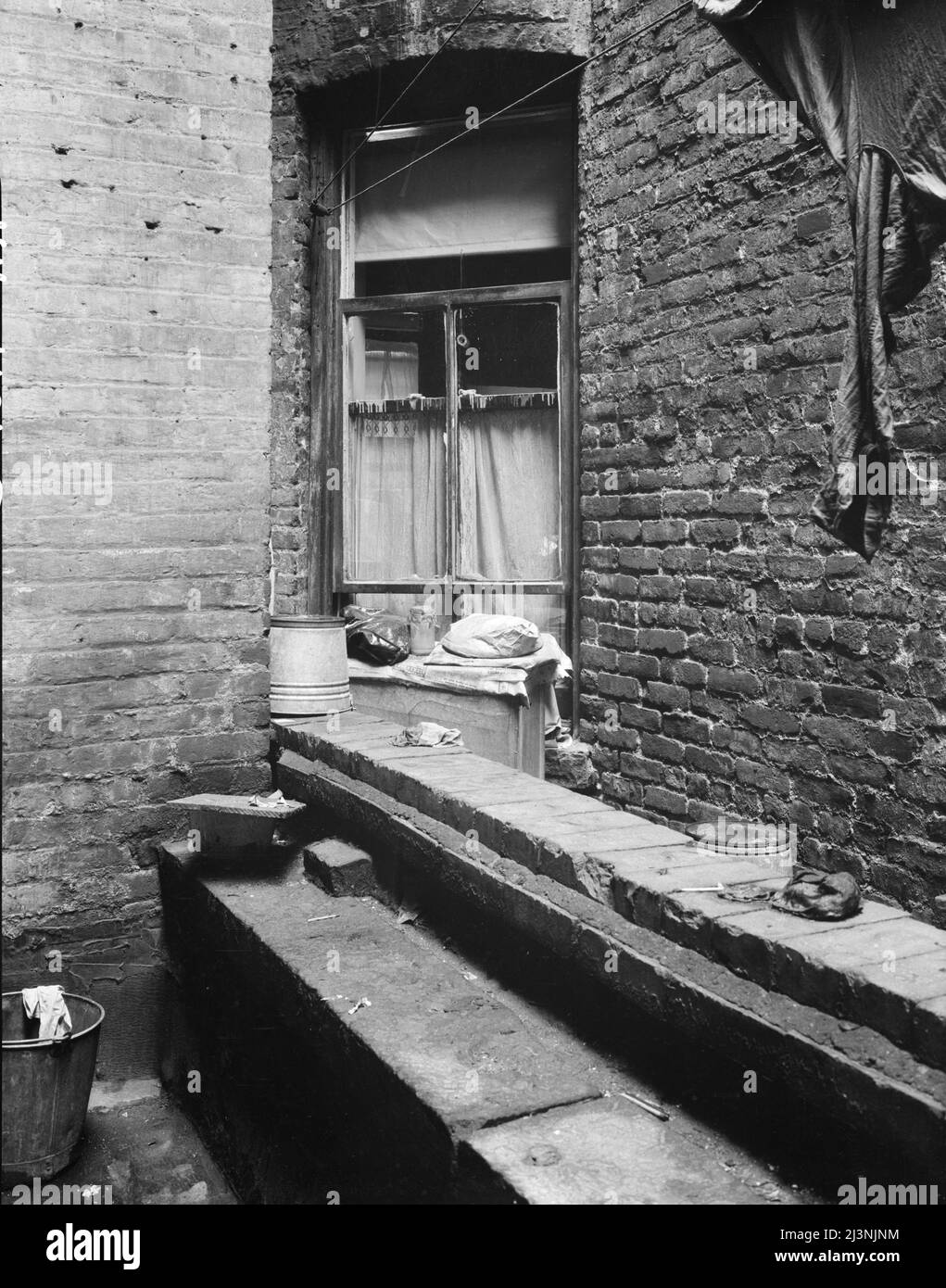 One of the rear windows, tenement dwelling of Mr. and Mrs. Jacob Solomon, 133 Aveue D, New York City. The Solomon family are on the accepted list for resettlement at Hightstown, New Jersey. Stock Photo