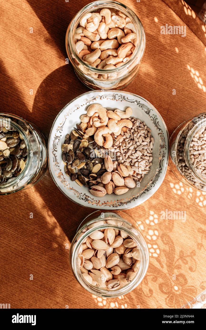 Cashew nuts, pistachios, sunflower seeds and pumpkin seeds in a glass