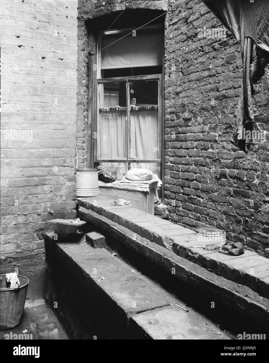 One of the rear windows, tenement dwelling of Mr. and Mrs. Jacob Solomon, 133 Aveue D, New York City. The Solomon family are on the accepted list for resettlement at Hightstown, New Jersey. Stock Photo