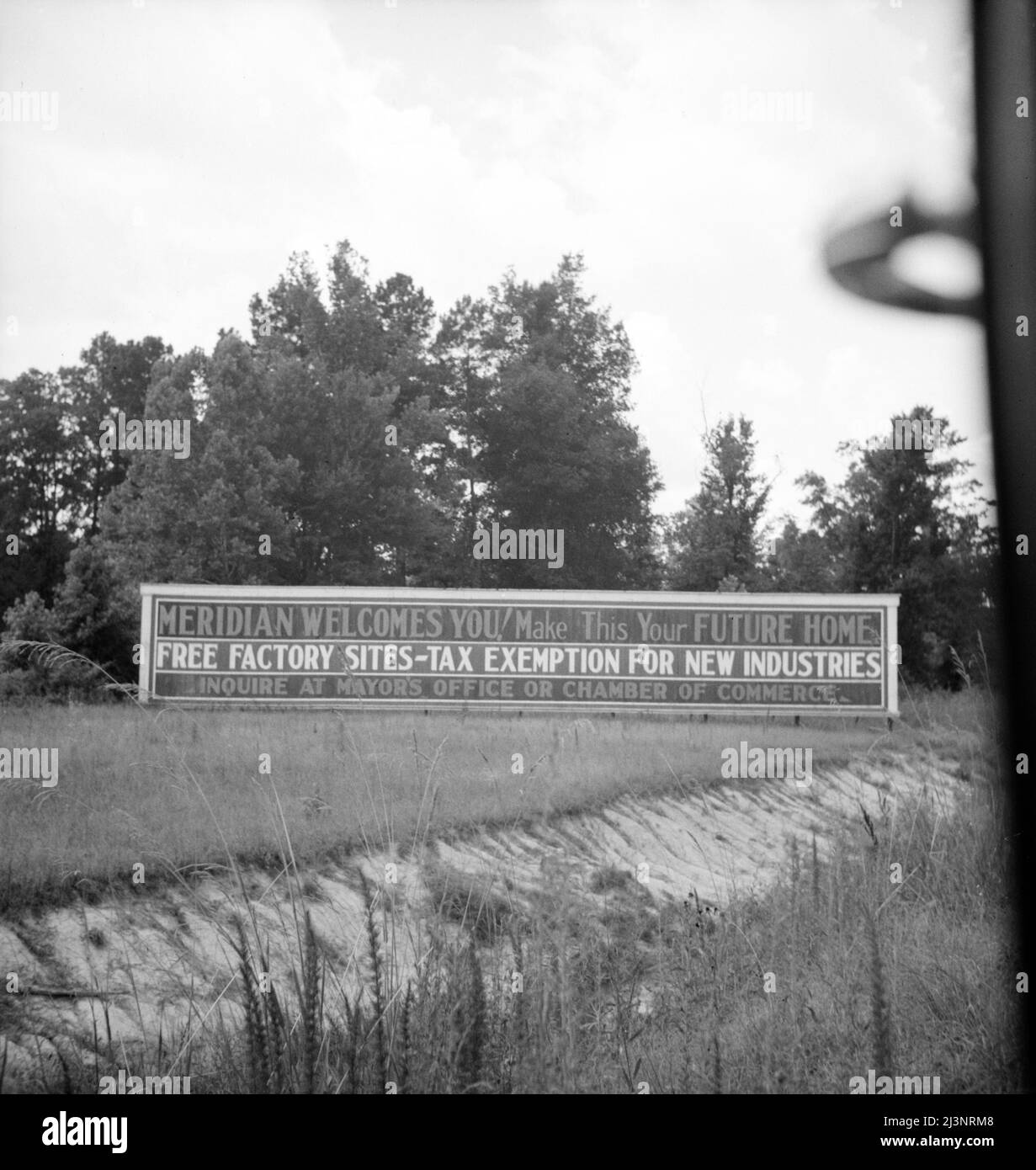 Note on industrialization of the South. Meridian, Mississippi. [Meridian Welcomes You! Make This Your Future Home; Free Factory Sites - Tax Exemption for New Industries; Inquire at Mayor's Office or Chamber of Commerce]. Stock Photo