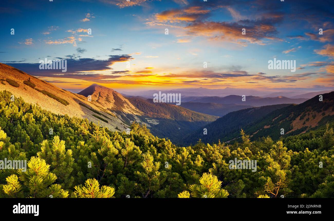 Landscape with mountains under morning sky with clouds Stock Photo - Alamy
