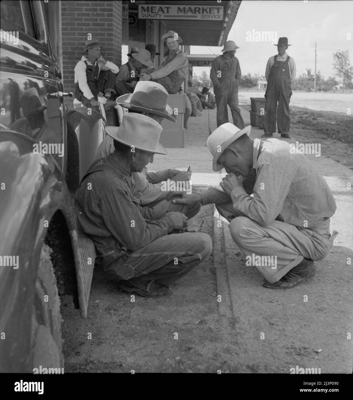 Dust bowl farmers of west Texas in town Stock Photo Alamy