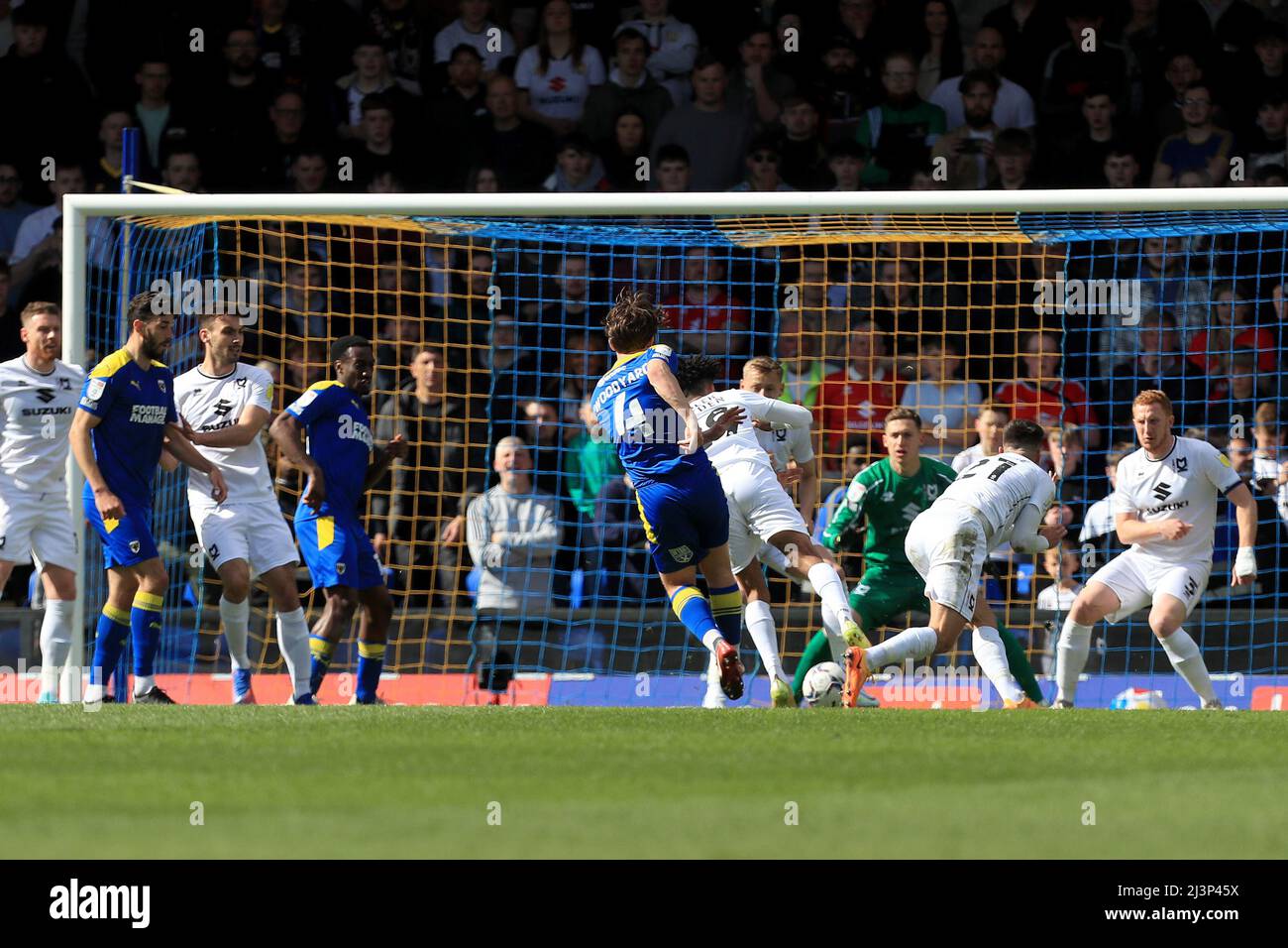 GOAL Alex Woodyard 4 of AFC Wimbledon shoots through a crowd of