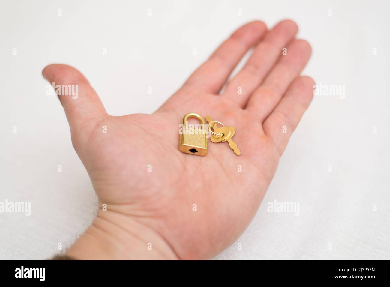 Woman hand open padlock hi-res stock photography and images - Alamy