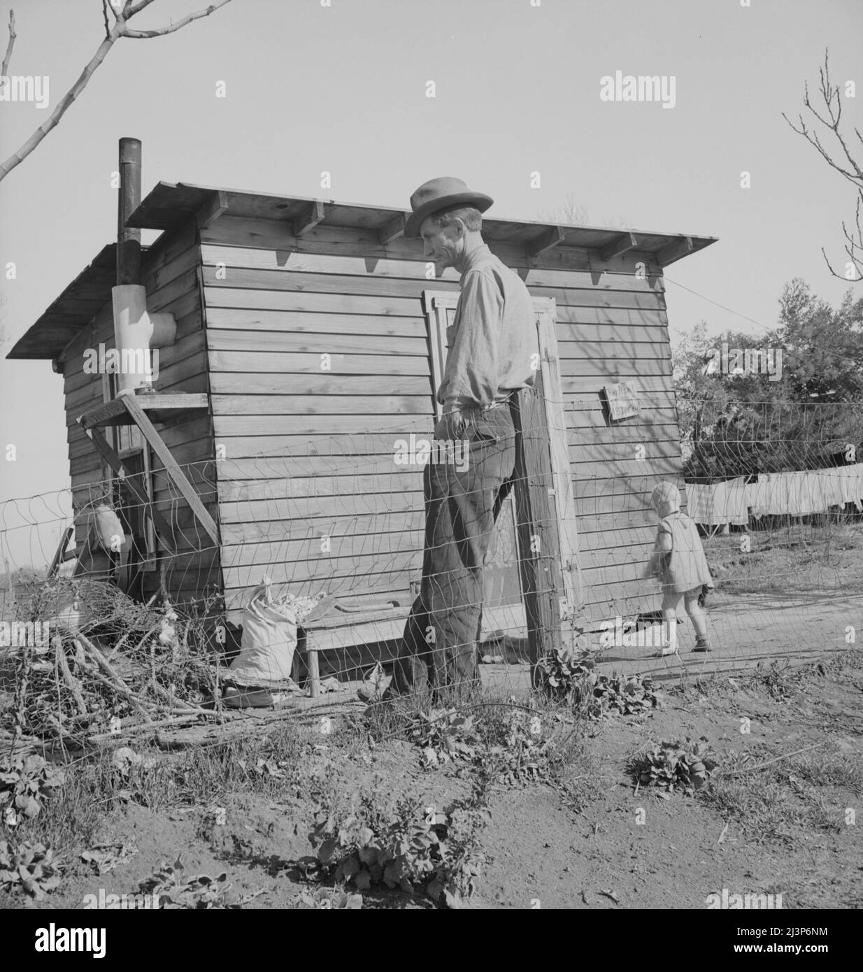 Madera County, family from near Dallas, Texas. Rent is five dollars a month. &quot;There's no future here. I've been following the work (migratory labor) but there's no chance for a fellow to get a holt hisself in this country. The last job I had is tractor driving for thirty-five cents an hour. Had that job for five months until a Filipino comes along for twenty-five cents an hour. I was raised on a cotton farm my father owned a little place back there and I'm plumb willing to leave this country for good before I get too old, If I could get the chance to farm.&quot;. Stock Photo