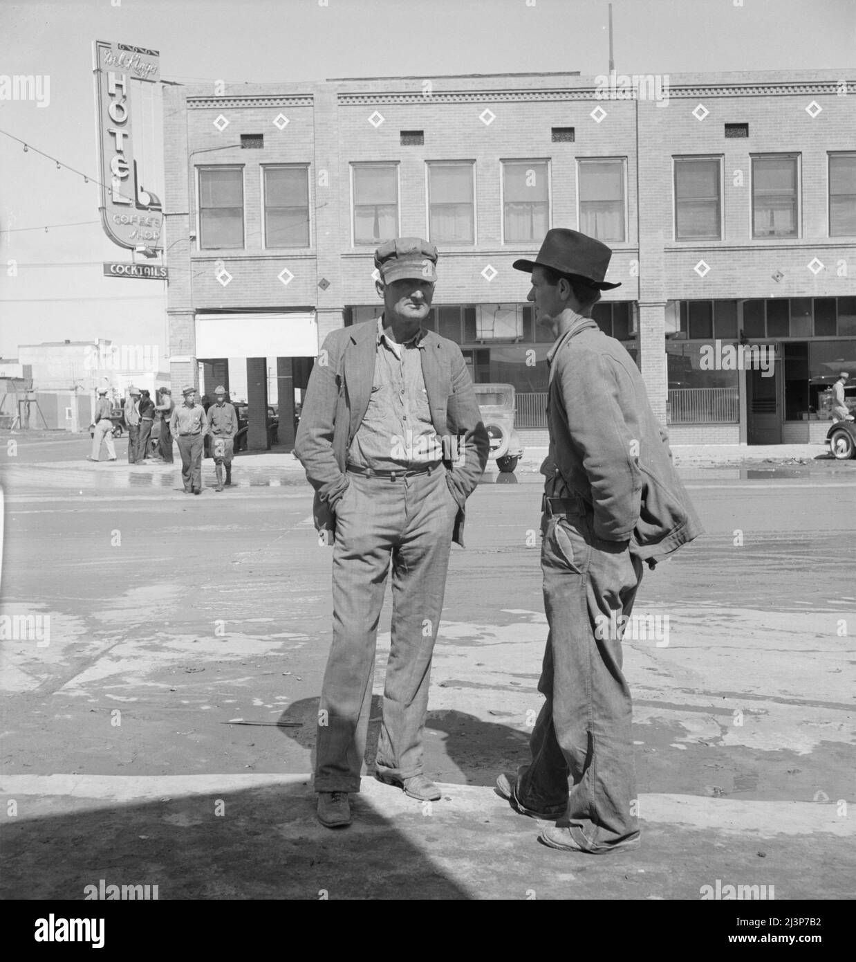 Calipatria, Imperial Valley. Idle pea pickers discuss prospects for