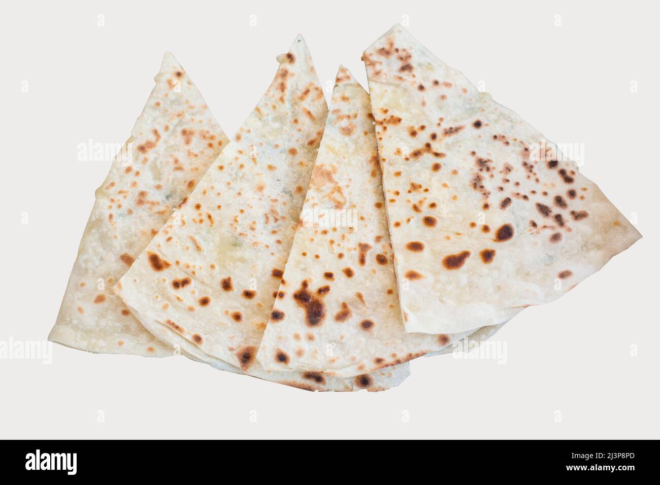 Pita bread with cottage cheese and greens on a white background