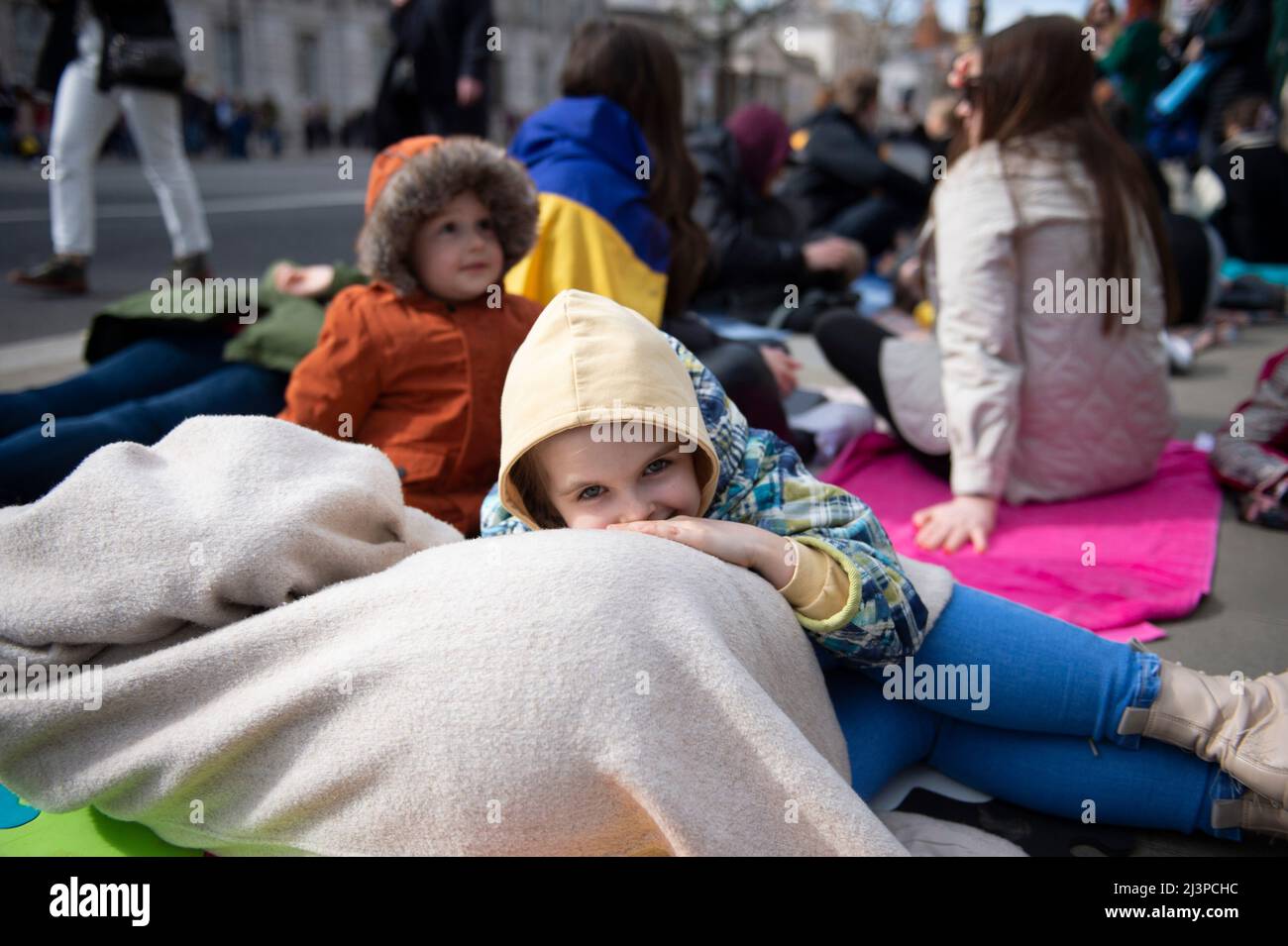 London, UK. 9th Apr, 2022. Demonstraters take part in a 'Die In' outside Downing Street in London, to denounce the Russian invasion of Ukraine. Credit: claire doherty/Alamy Live News Stock Photo
