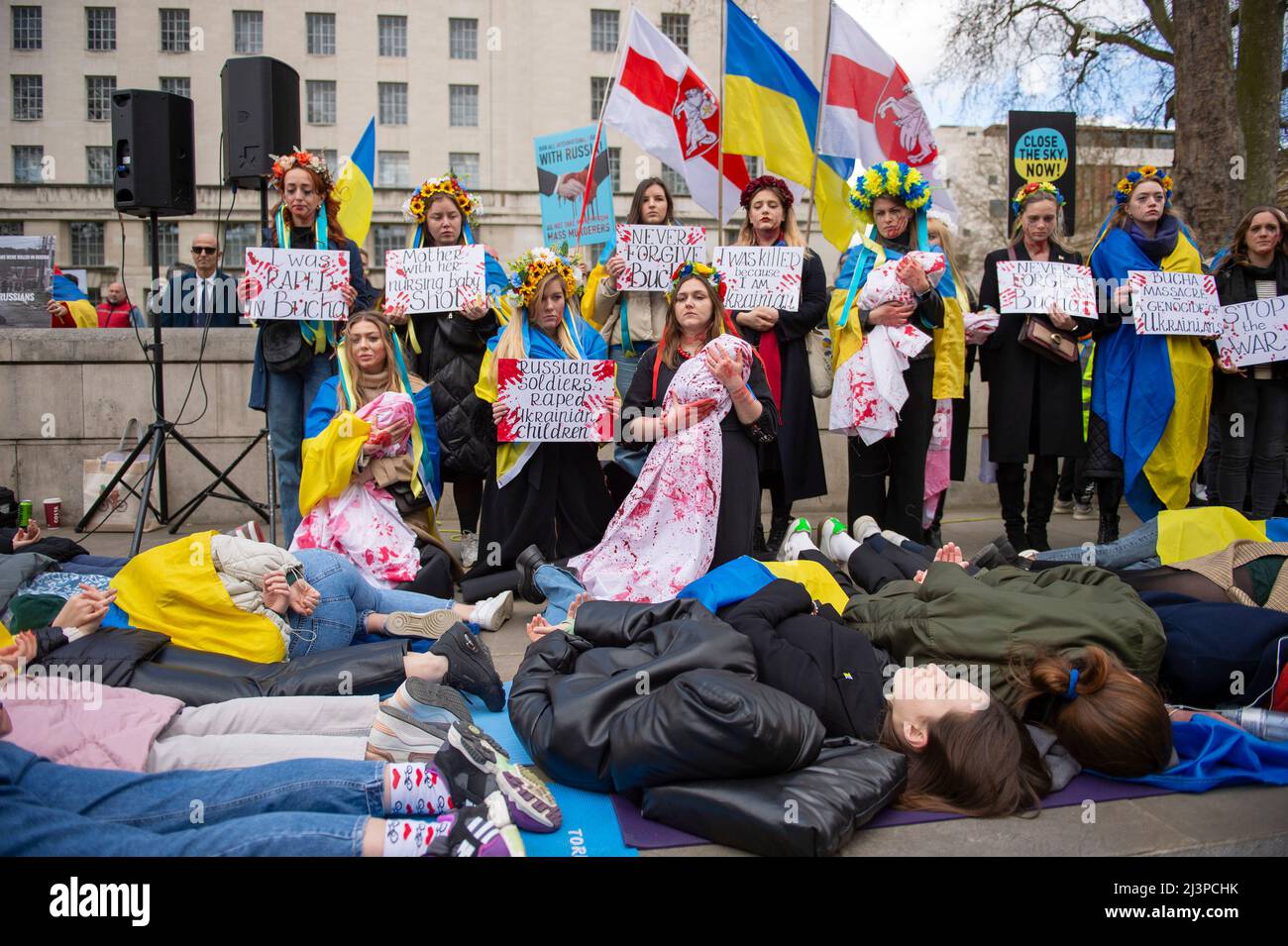 London, UK. 9th Apr, 2022. Demonstraters take part in a 'Die In' outside Downing Street in London, to denounce the Russian invasion of Ukraine. Credit: claire doherty/Alamy Live News Stock Photo