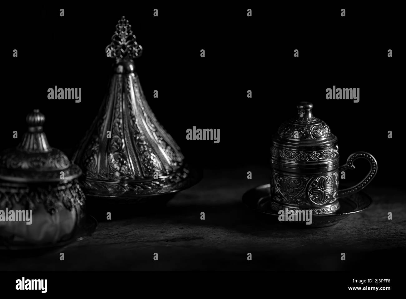 Silver coffee or tea cup and sugar jars with Dates Stock Photo