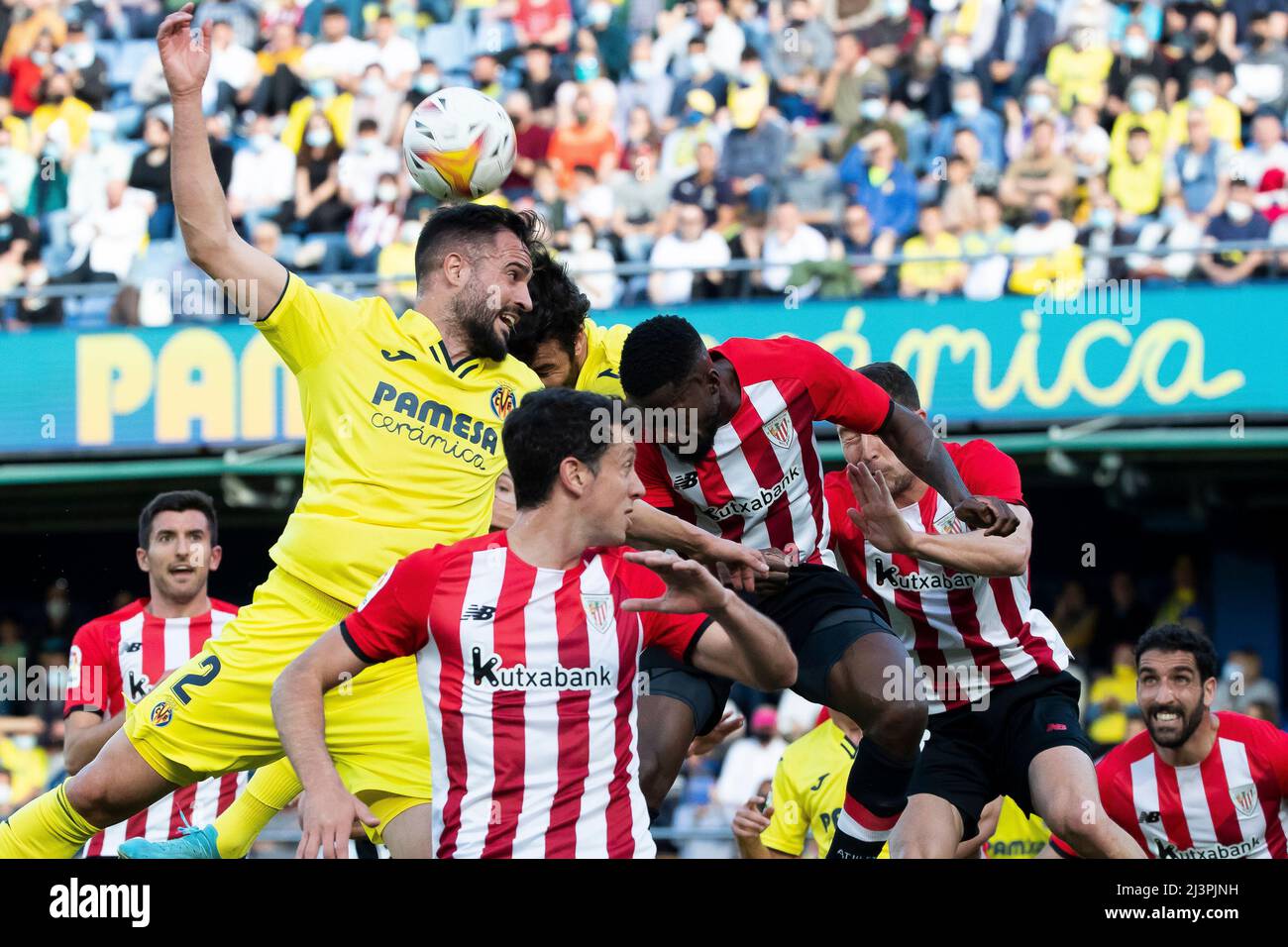 Villarreal, Spain, April 9, 2022. Villarreal's Mario Gaspar (L) and Inaki  Williams of Athletic club de Bilbao (R) jumps for the ball during La Liga  match between Villarreal cf vs Athletic club