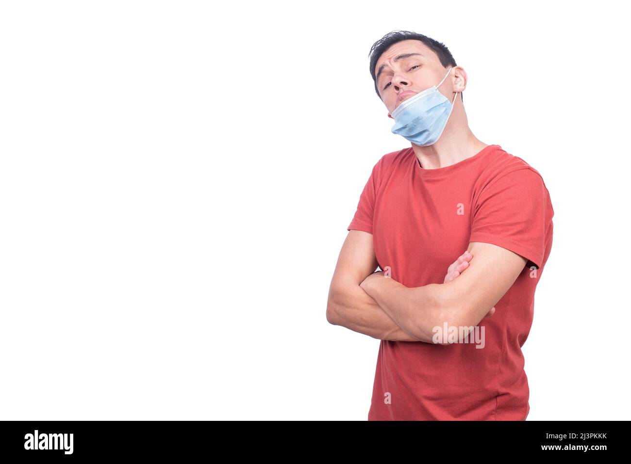 Irresponsible man with misplaced medical mask during COVID pandemic Stock Photo