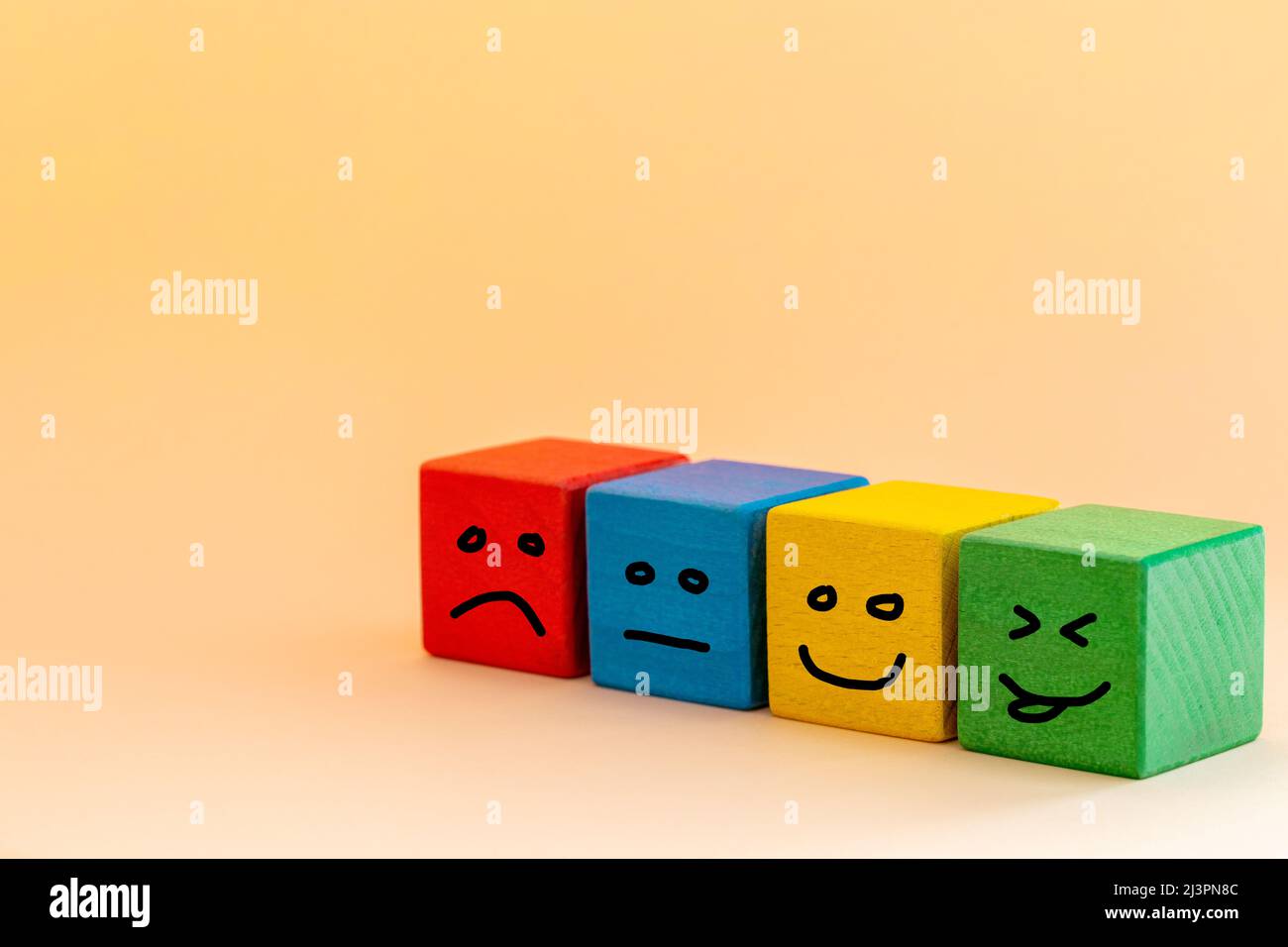 Smile and change your sad face, Colorful wooden blocks with painted