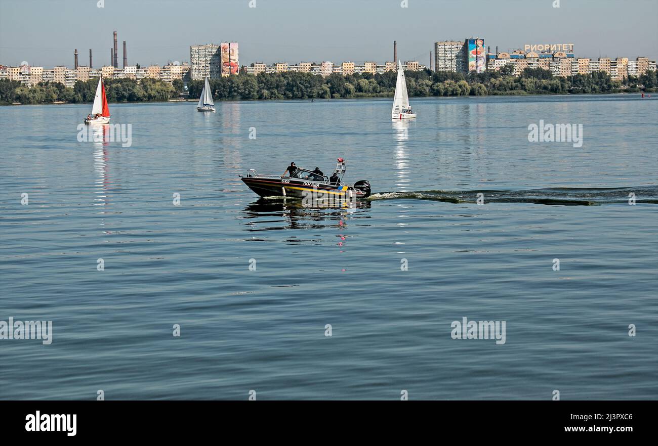 Dnepropetrovsk, Ukraine - 09.11.2021: Water police patrol the parade of sailing yachts on the Dnieper river. Stock Photo