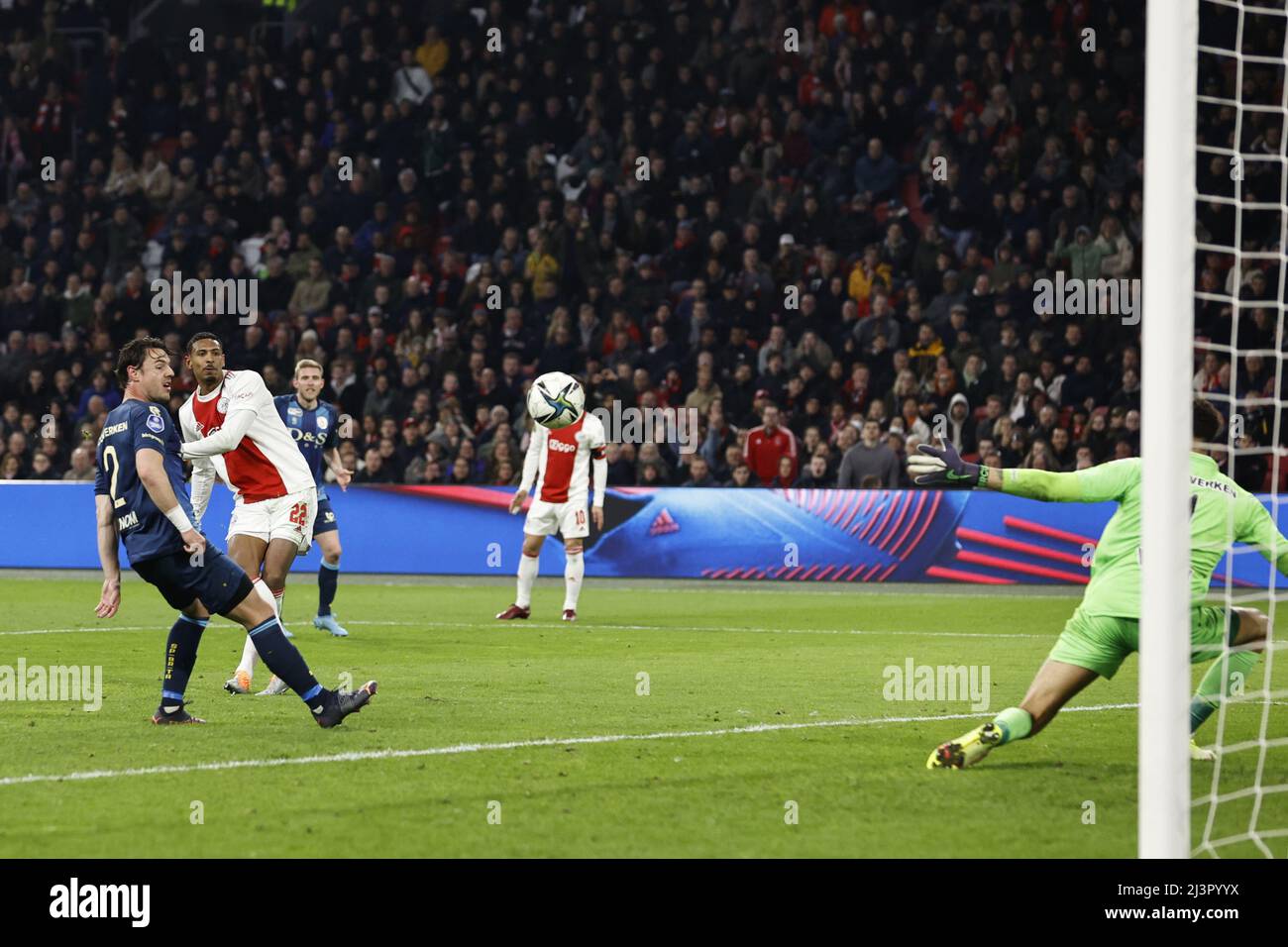 AMSTERDAM - (lr) Dirk Abels of Sparta Rotterdam, Sebastien Haller of Ajax scores but the goal is disallowed during the Dutch Eredivisie match between Ajax and Sparta Rotterdam at the Johan Cruijff ArenA on April 9, 2022 in Amsterdam, Netherlands. ANP MAURICE VAN STEEN Stock Photo