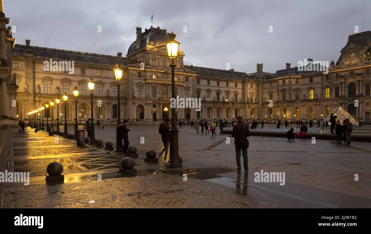 Urban landscape of a sunset at the Louvre Palace, an iconic building of the French state located on the Right Bank of the river Seine in Paris Stock Photo