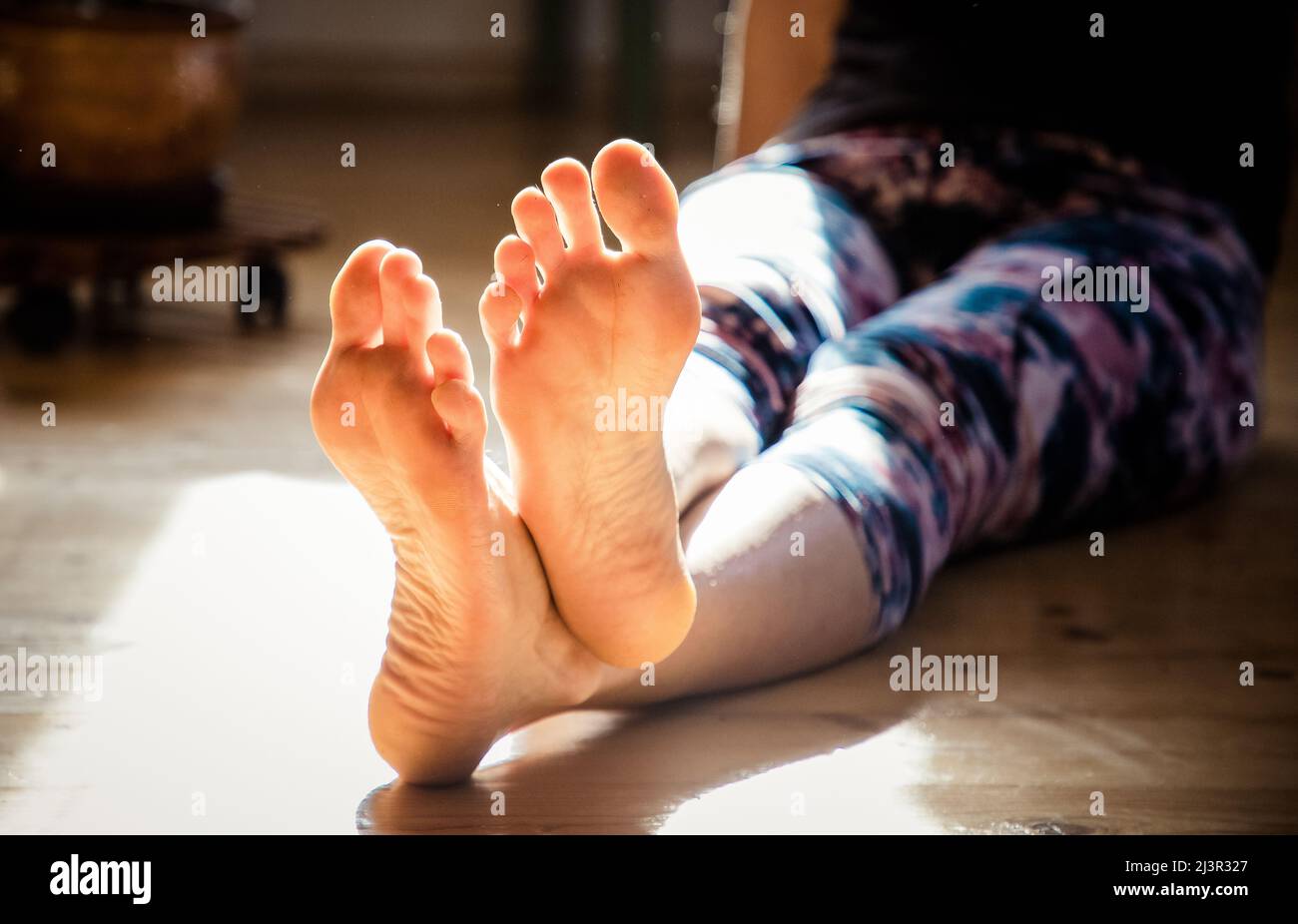 Barefoot sitting hi-res stock photography and images - Alamy