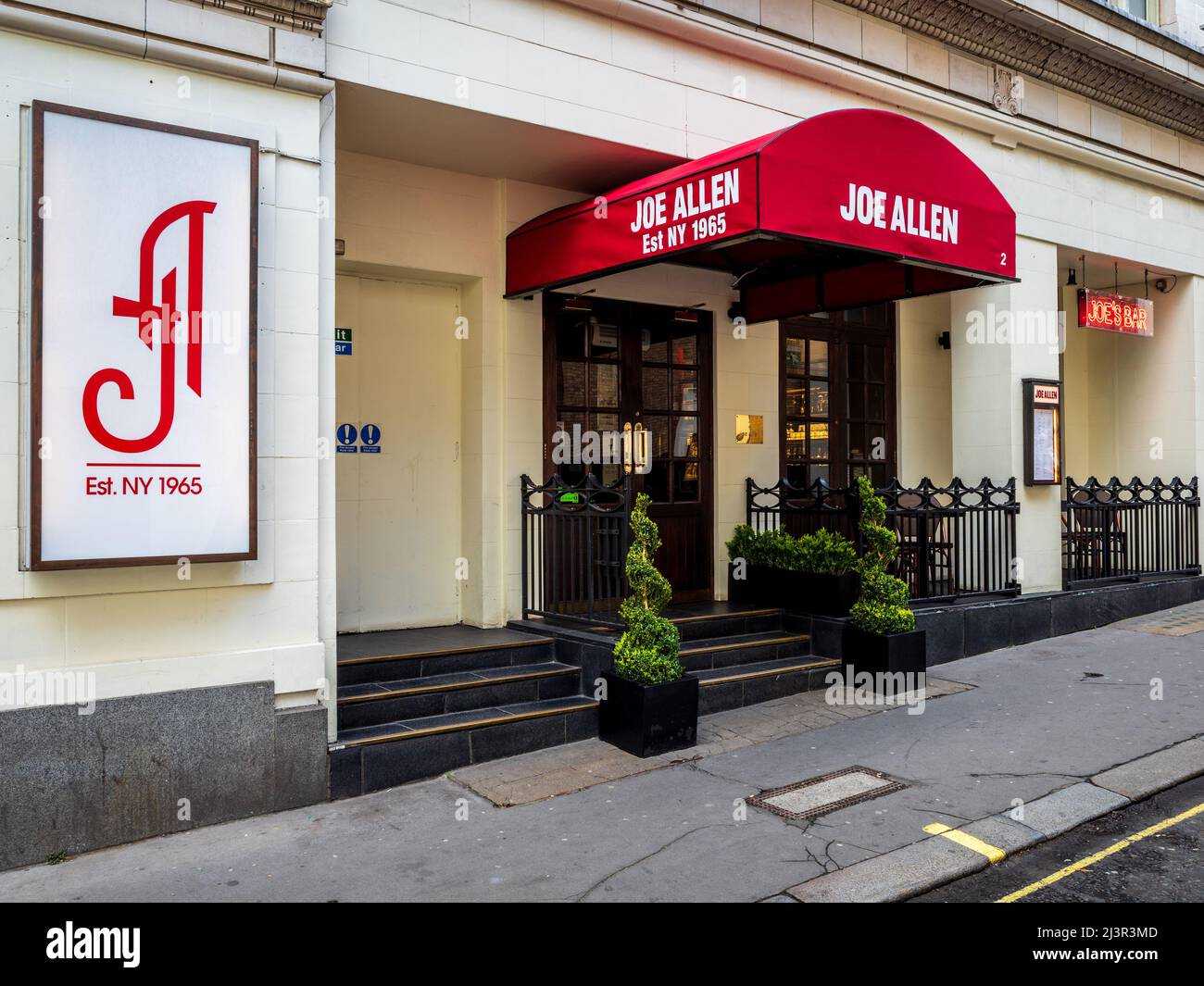 Joe Allen Bar & Restaurant on Burleigh St between the Strand and Covent Garden in Central London - NY style London restaurant, opened 1977. Stock Photo