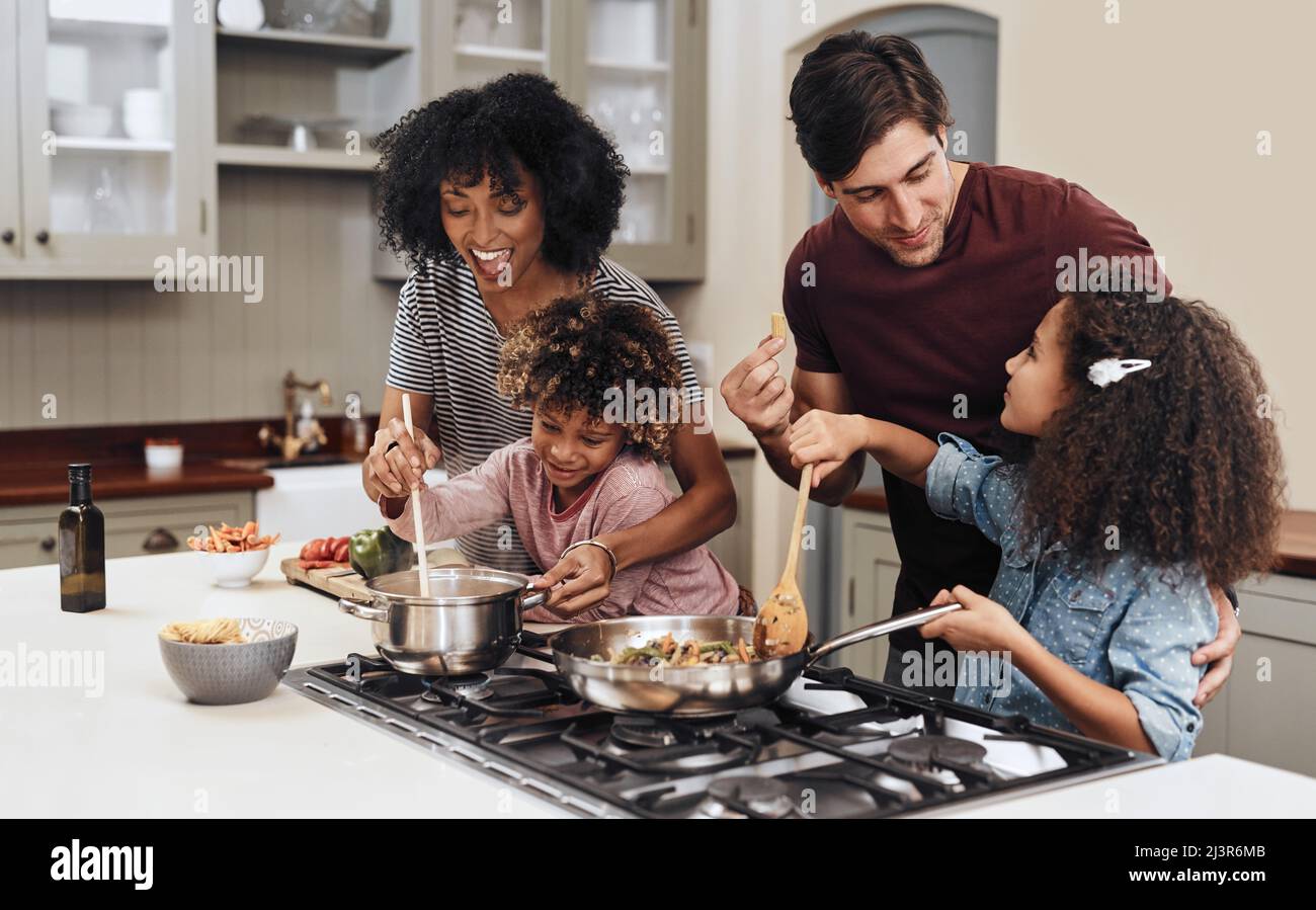 Our Sunday tradition. Mom dad and daughter aprons in kitchen. Cooking  concept. Prepare delicious breakfast. Lunch time. Family having fun cooking  together. Teach kid cooking food. Cooking together Stock Photo - Alamy