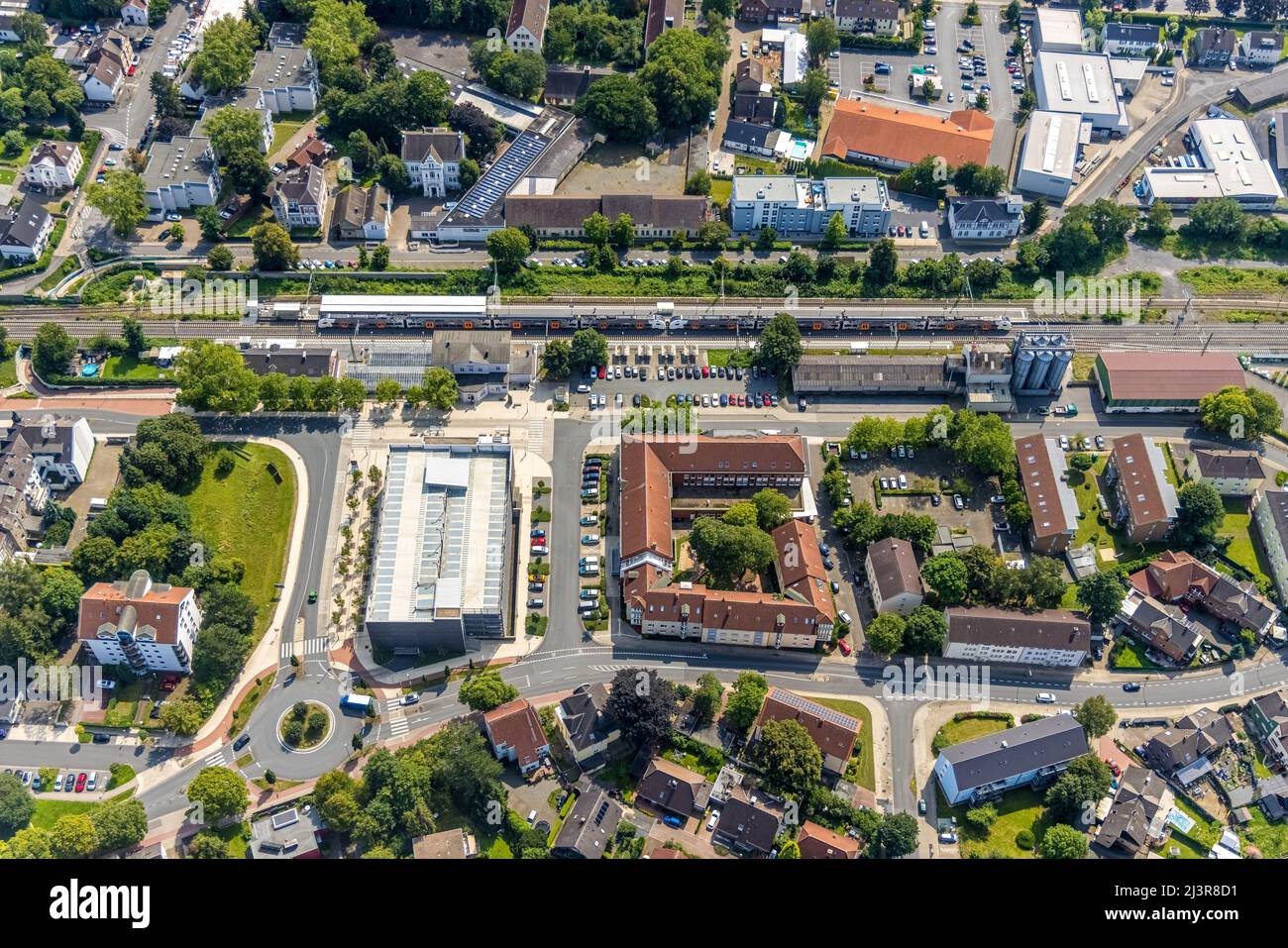 Aerial view, Kamen railway station with multi-storey car park and building of the Unna district police authority Kamen police station, Kamen, Ruhr are Stock Photo